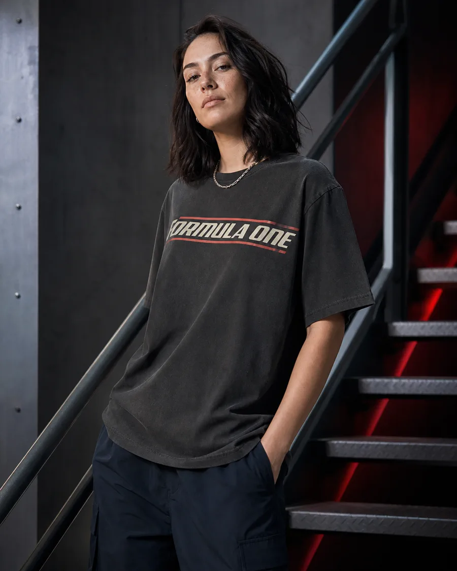Adult model wearing a charcoal Formula One inspired T-shirt